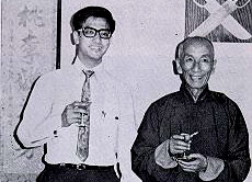 Leung Ting standing beside Grandmaster Yip Man